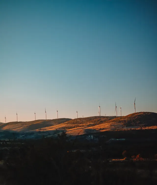 Wind farm across rolling hills